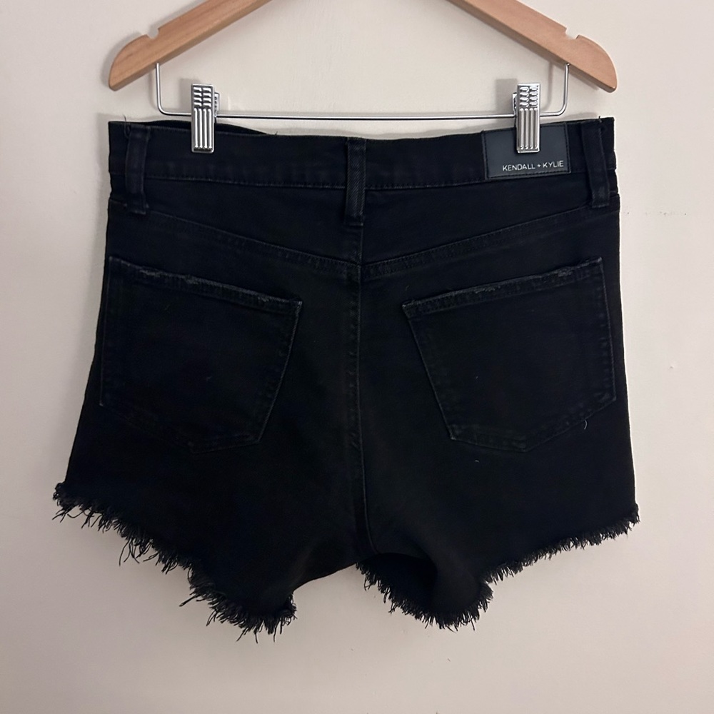 black ripped jean shorts